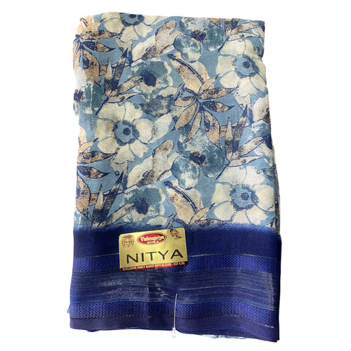 mahalakshmi paradise floral printed saree in blue with a contrasting dark blue border and soft fabric finish.